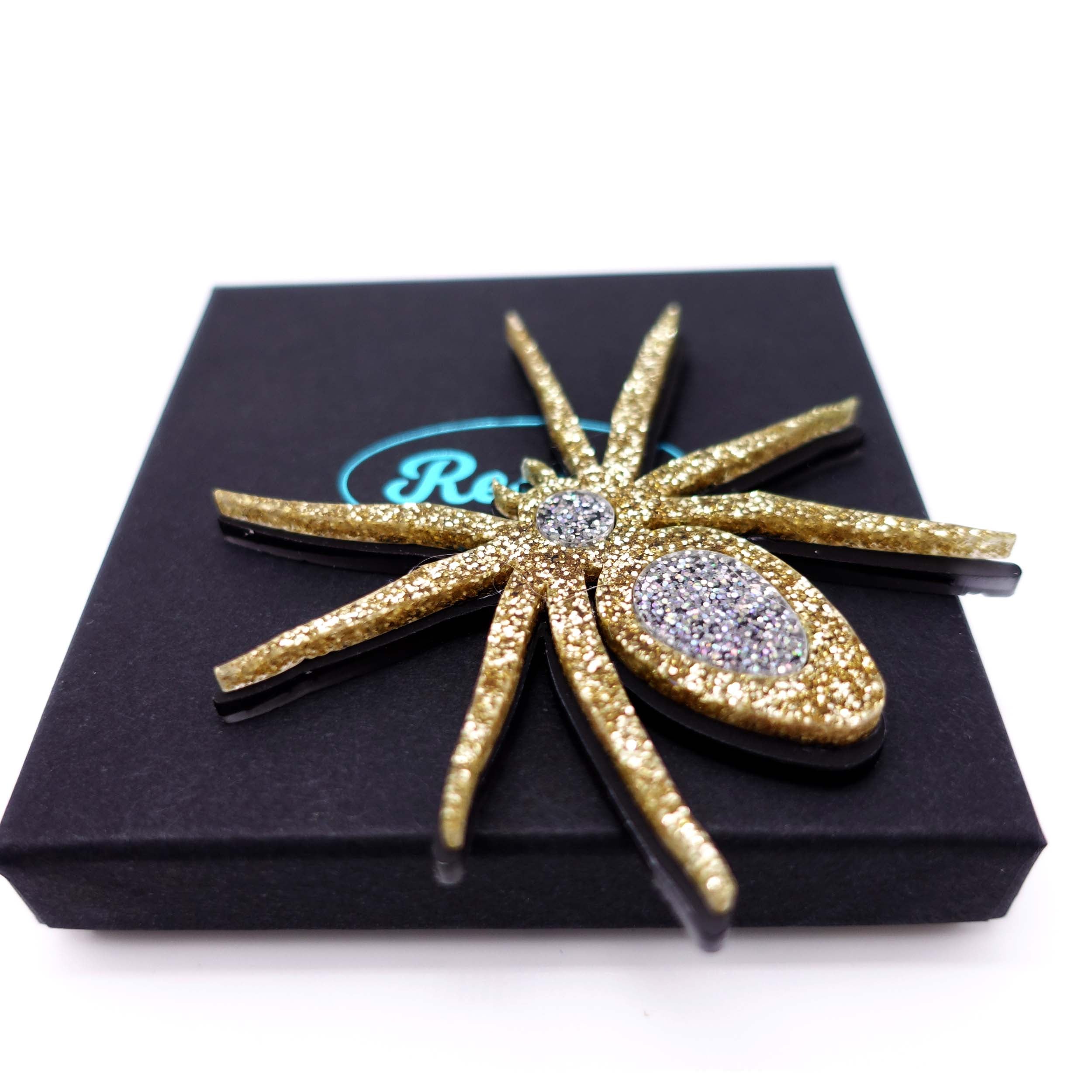 Gold Lady Hale spider brooch. £2 goes to Women for Refugee Women. 