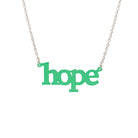 Hope necklace in leaf frost shown on a silver chain hanging on a white background. 