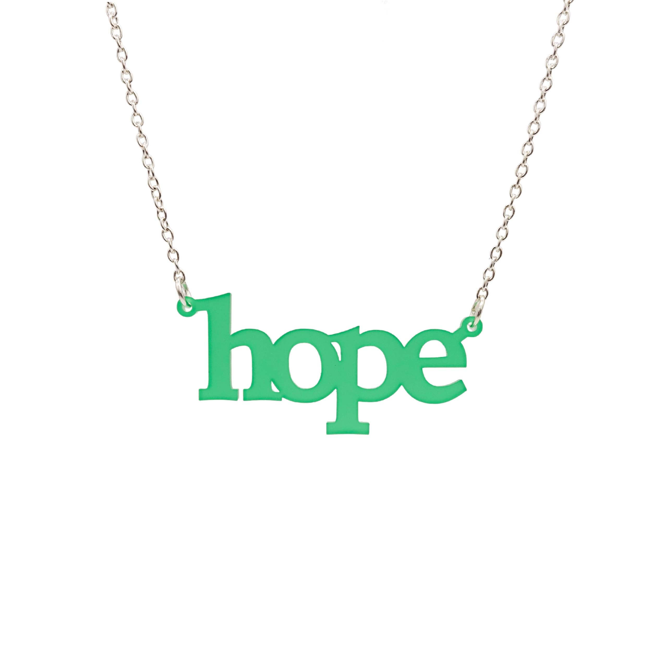 Hope necklace in leaf frost shown on a silver chain hanging on a white background. 