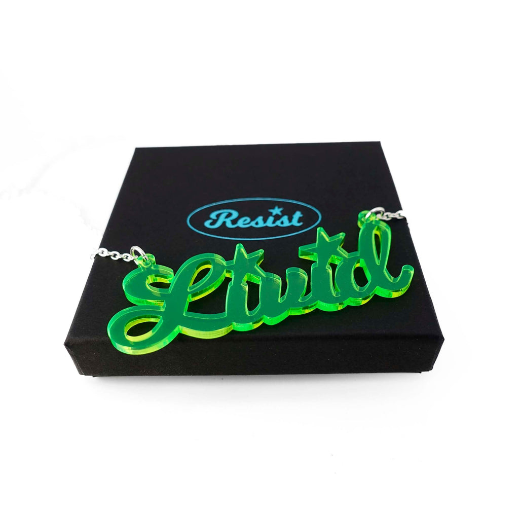 Livid necklace in citrus lime shown on a Wear and Resist gift box. 