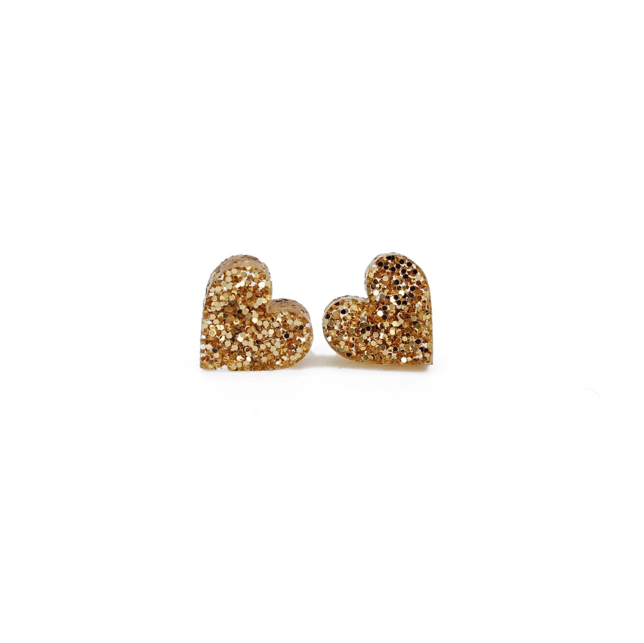 Little heart earrings in gold glitter. 