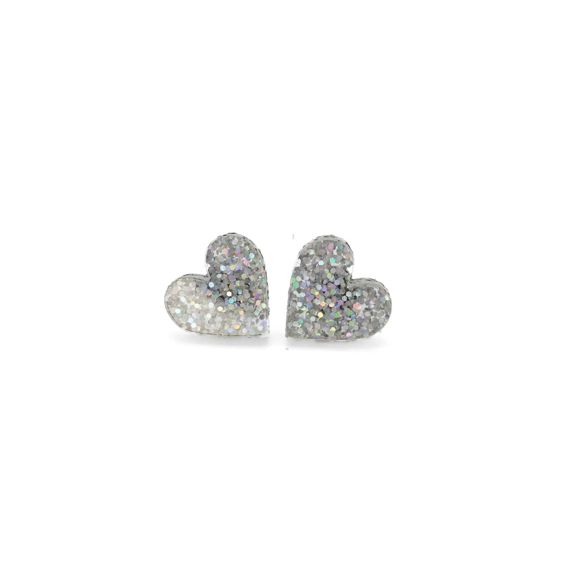 Little heart earrings in silver glitter. 