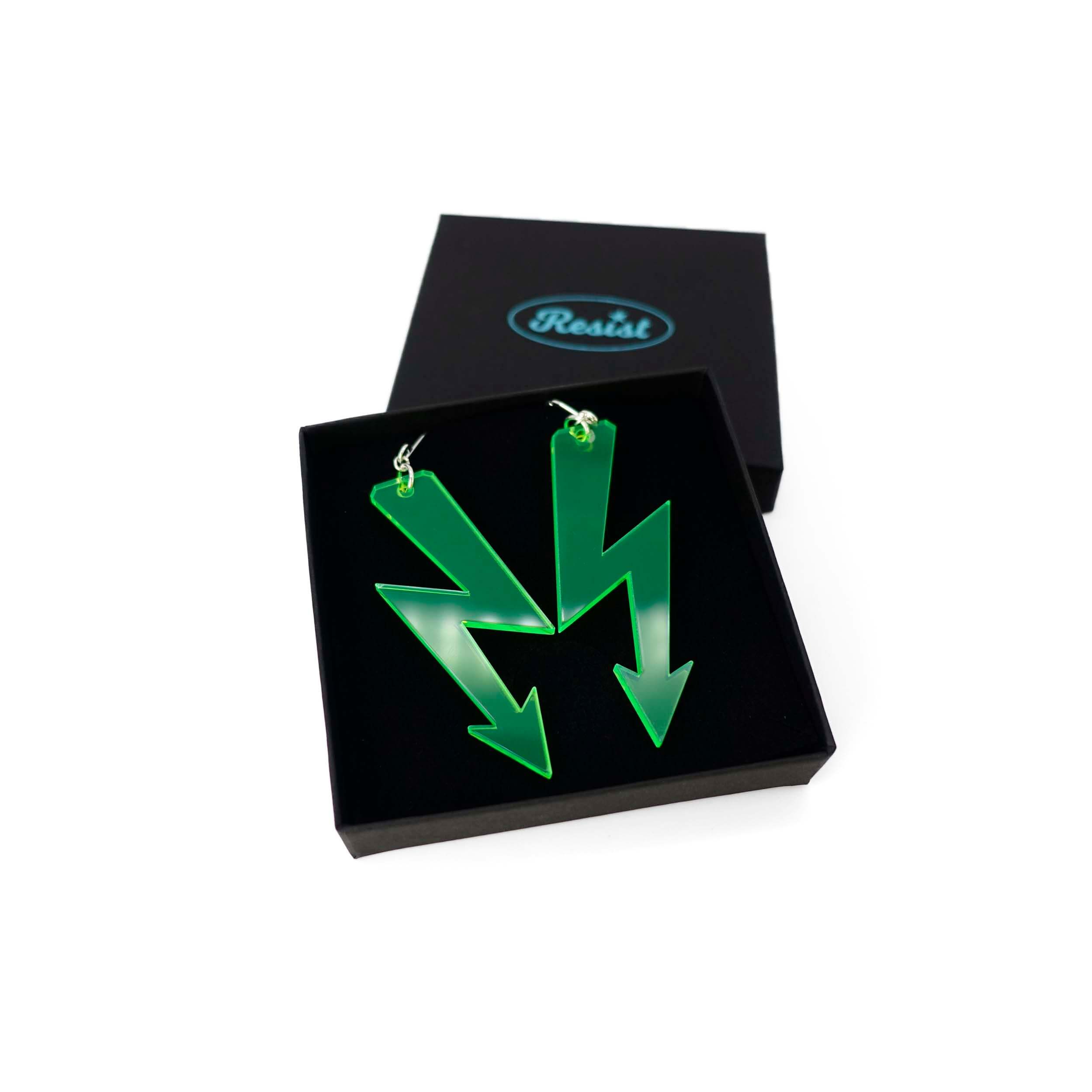 Neon lime High Voltage earrings shown in a Wear and Resist gift box. 