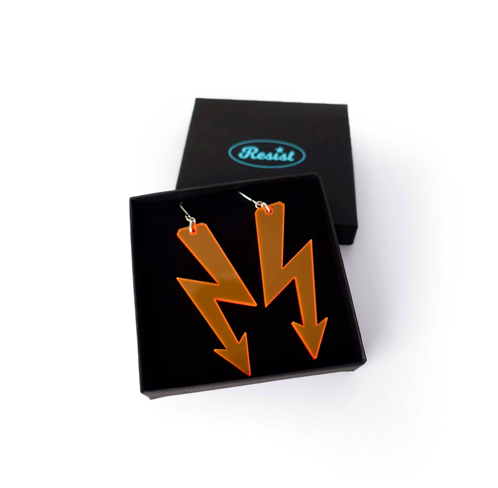 Fluoro orange High Voltage earrings in a Wear and Resist gift box. 