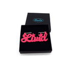 Livid necklace in hot pink, shown in a Wear and Resist gift box. 