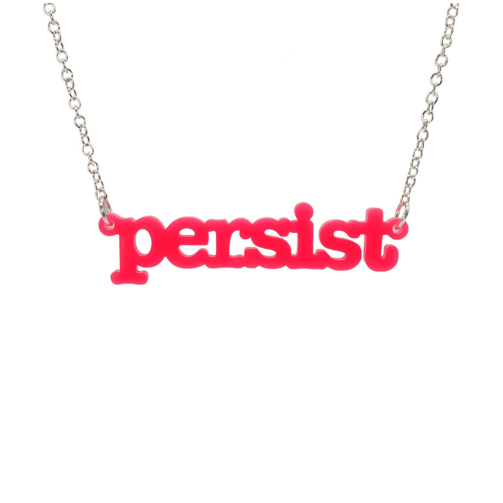 Hot pink Persist necklace in typewriter font hanging on a silver chain against a white background. 