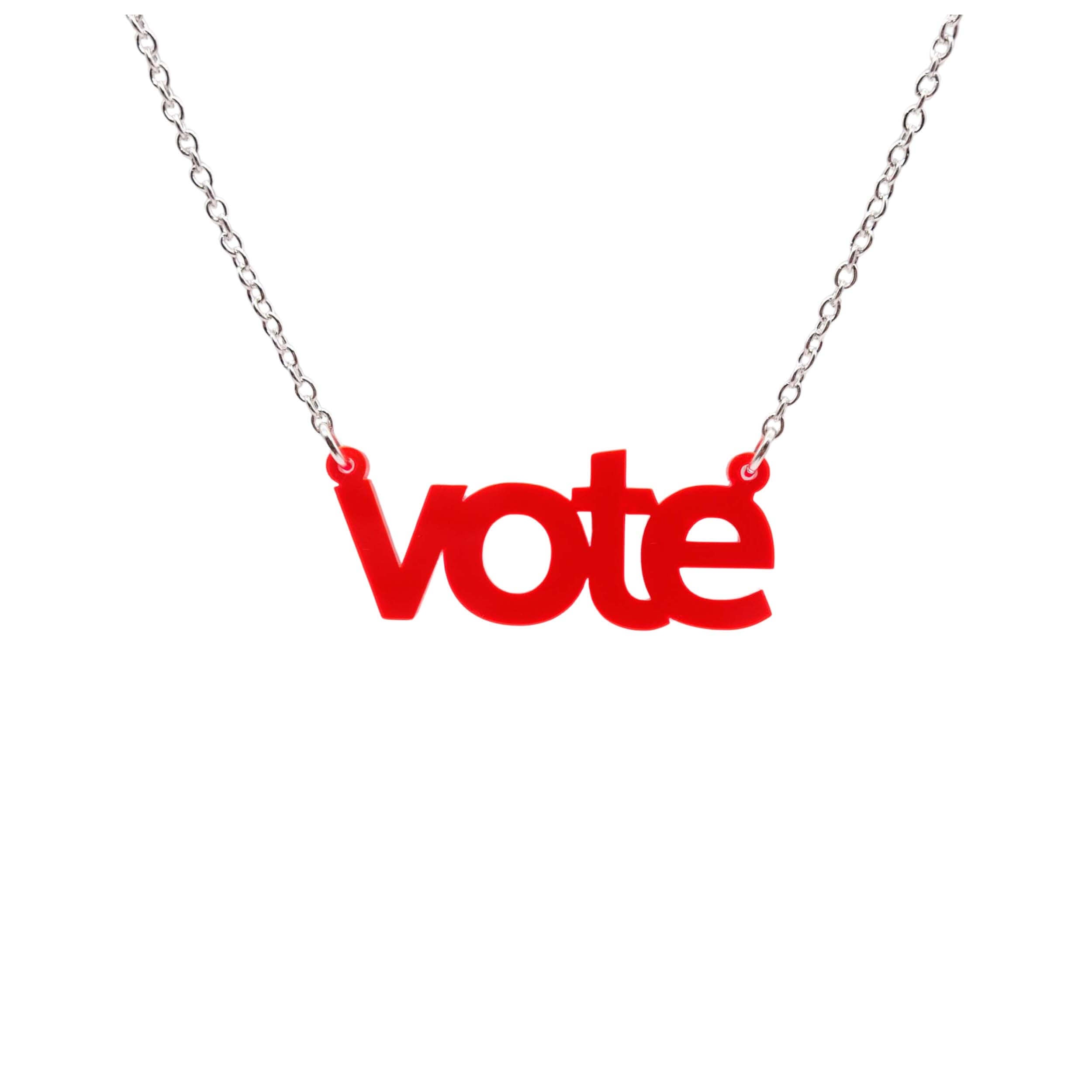 Vote necklace in hot red shown hanging against a white background. 