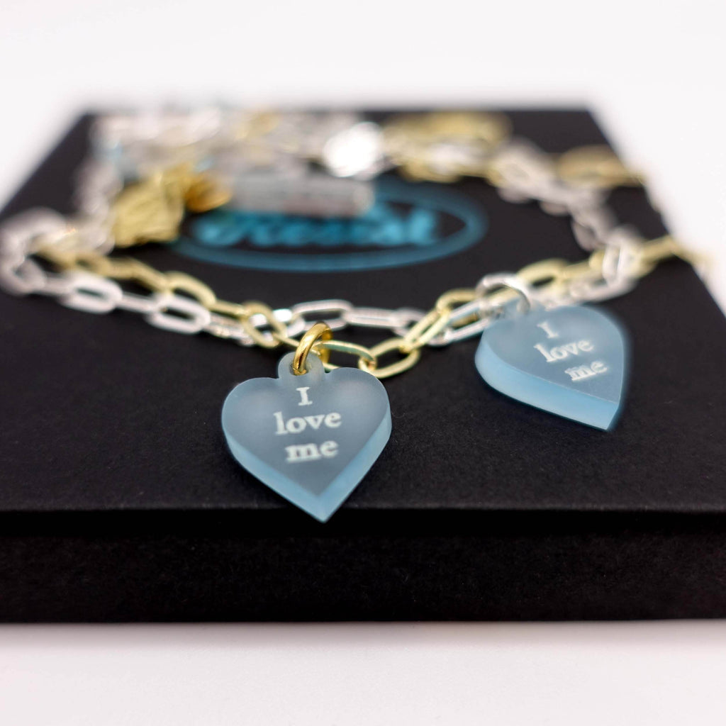 I love me glow in the dark choker and bracelet on a choice of silver or gold plated delicate paperclip chain, shown on a Wear and Resist gift box.  Self love is the best love! 