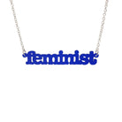 Indigo frost  Feminist necklace shown hanging on a white background. 
