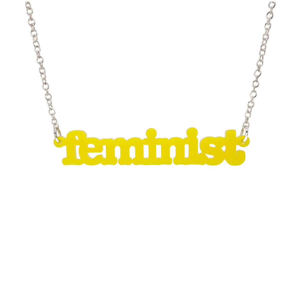 Lemon  Feminist necklace shown hanging on a white background. 