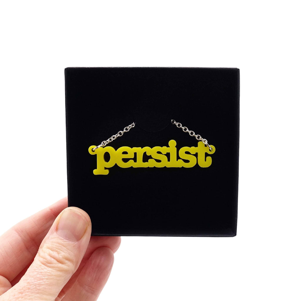Lemon Persist necklace shown in a Wear and Resist gift box. 