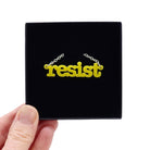 Lemon Resist necklace in typewriter font shown in a Wear and Resist gift box. 