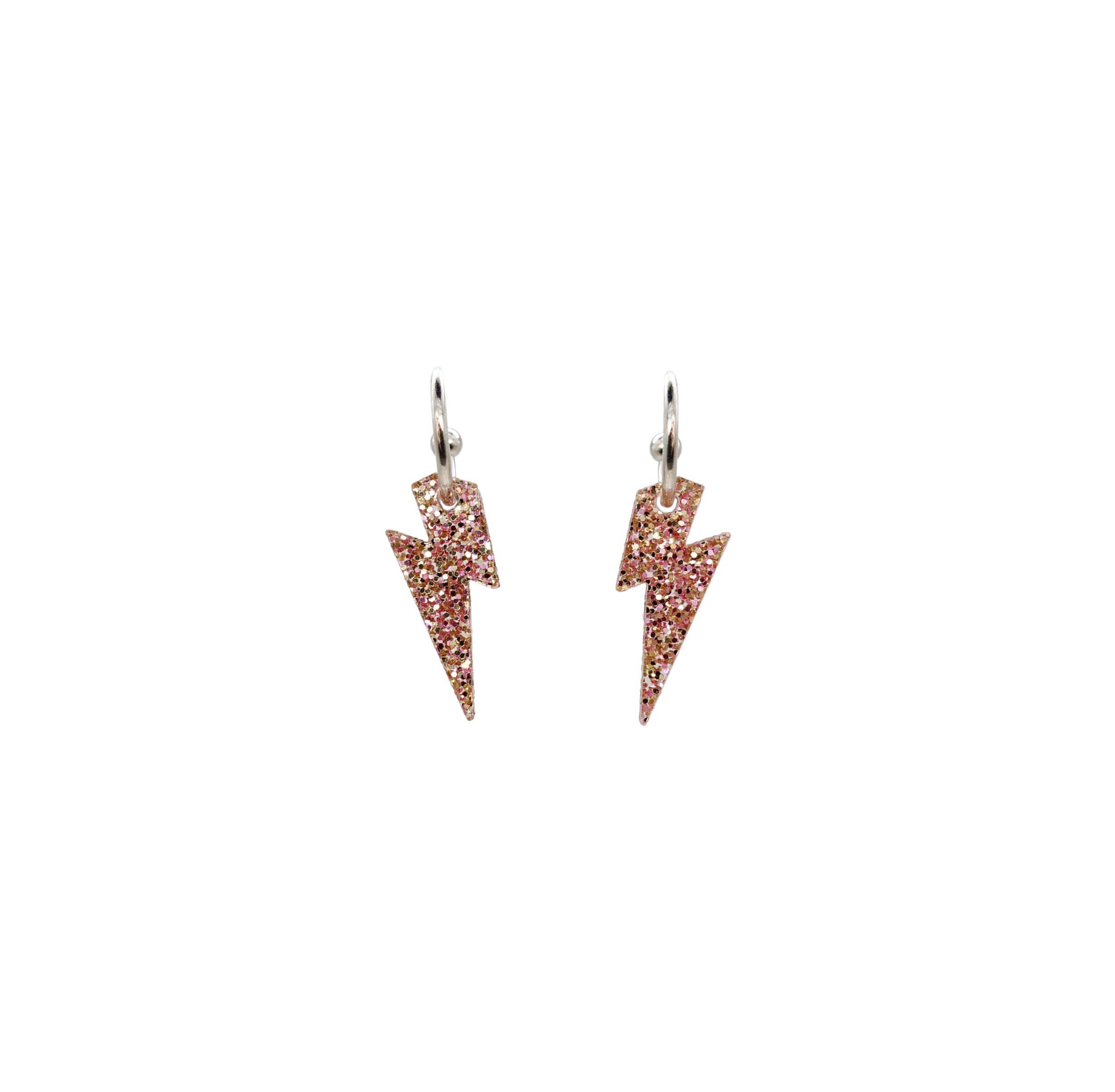 Lightning bolt hoop earrings in pink fizz glitter. 