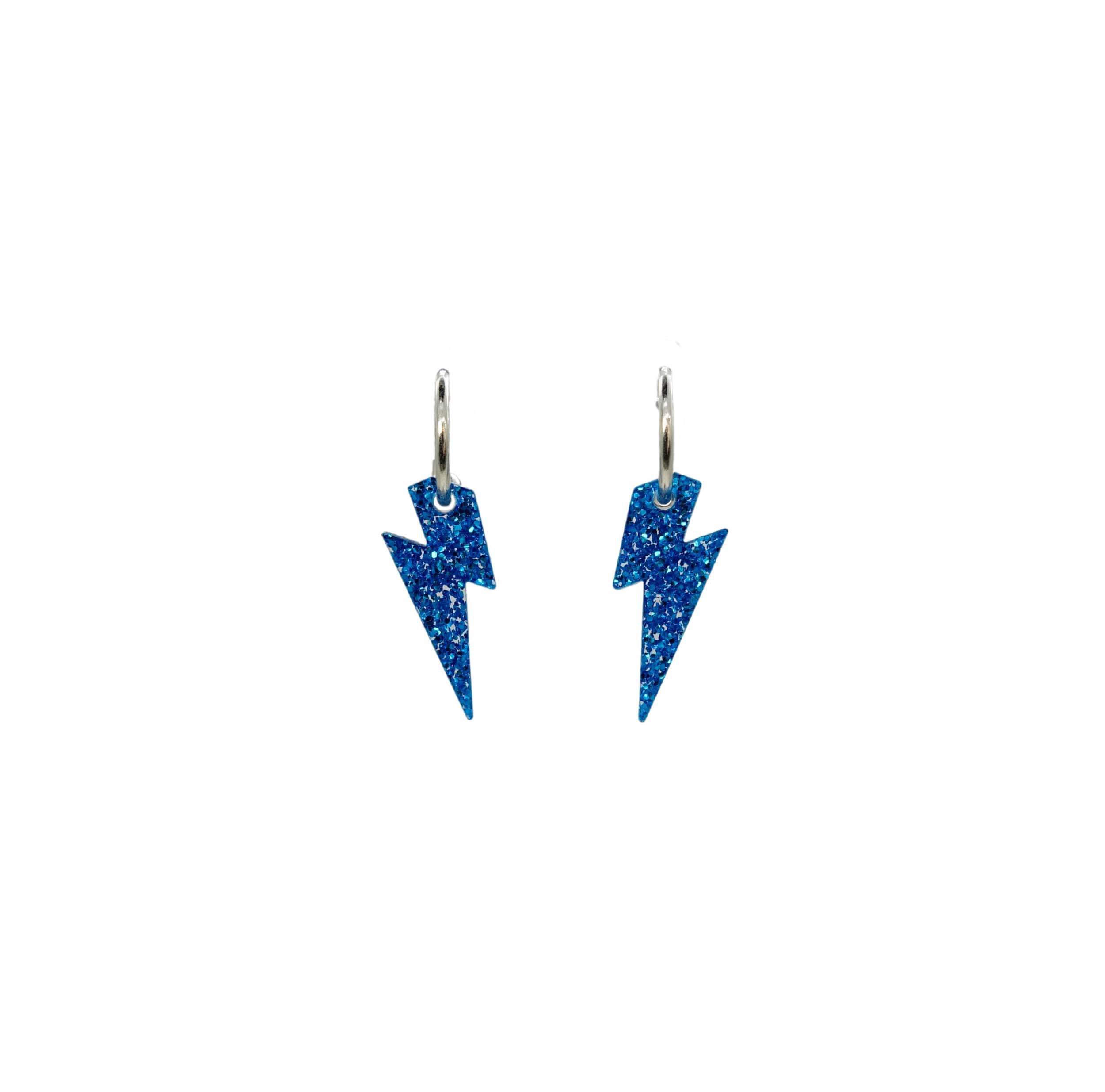 Lightning bolt hoop earrings in blue glitter. 