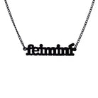 Irish Gaelic Feiminí necklace in matte black, shown hanging against a white background. 