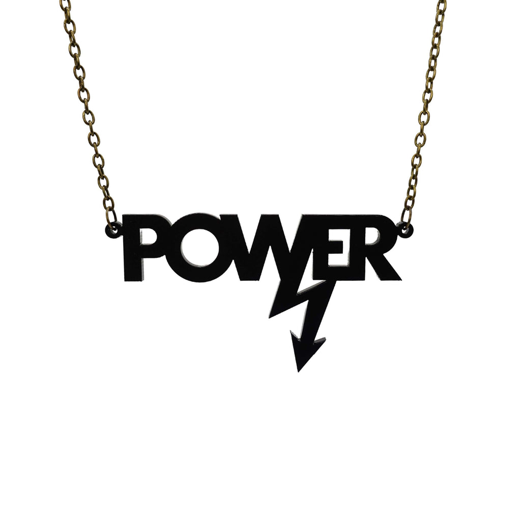 Matte black large Power necklace on a black chain, designed in collaboration with Mary Beard to celebrate her book, Women & Power. 