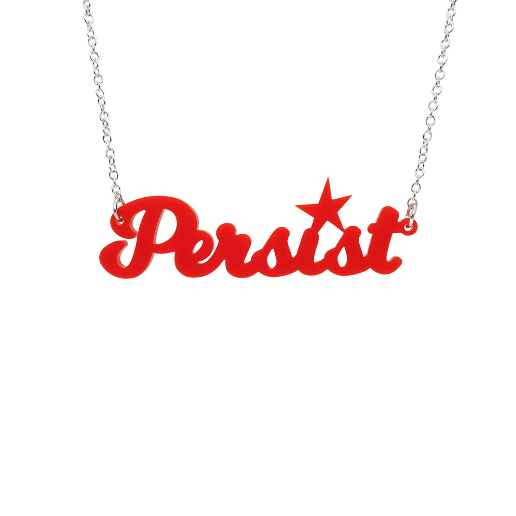 Matte red script Persist necklace shown hanging against a white background. 