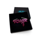 Mini power necklace in neon pink shown in a Wear and Resist gift box. 