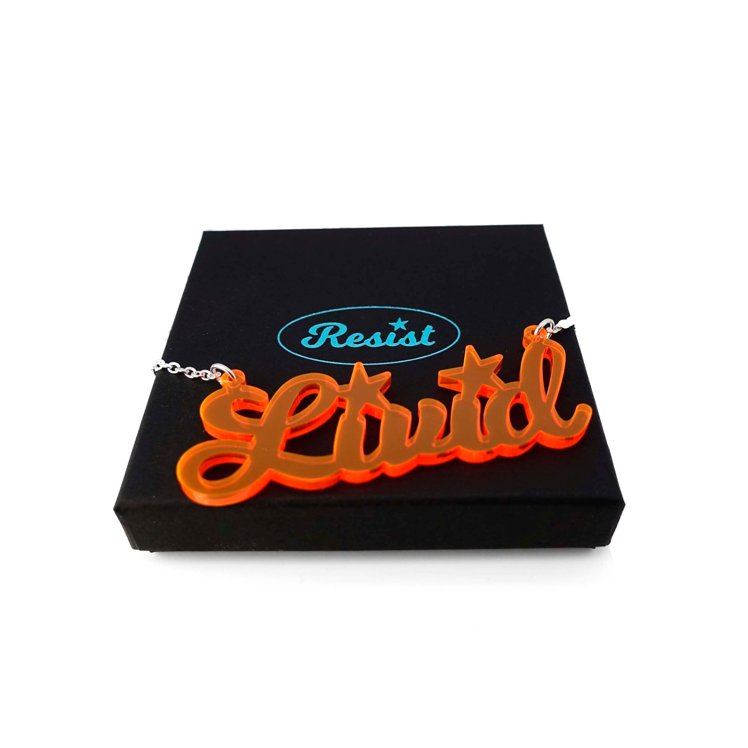 Livid necklace in fluorescent orange shown on a Wear and Resist gift box. 