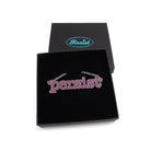 Typewriter Resist necklace in pink frost shown in a Wear and Resist gift box.
