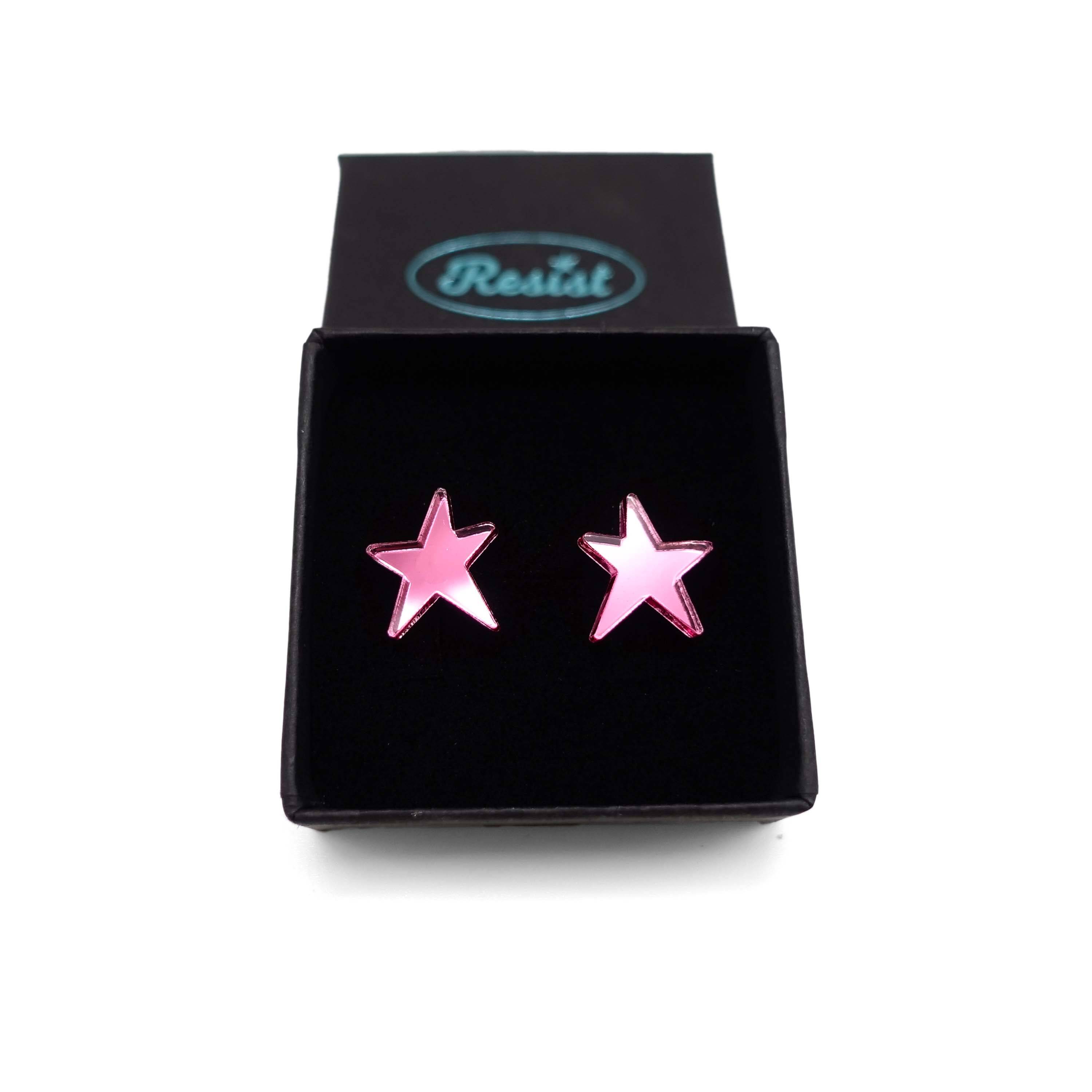 Pink mirror funky Resist star earrings shown in a Wear and Resist gift box. 