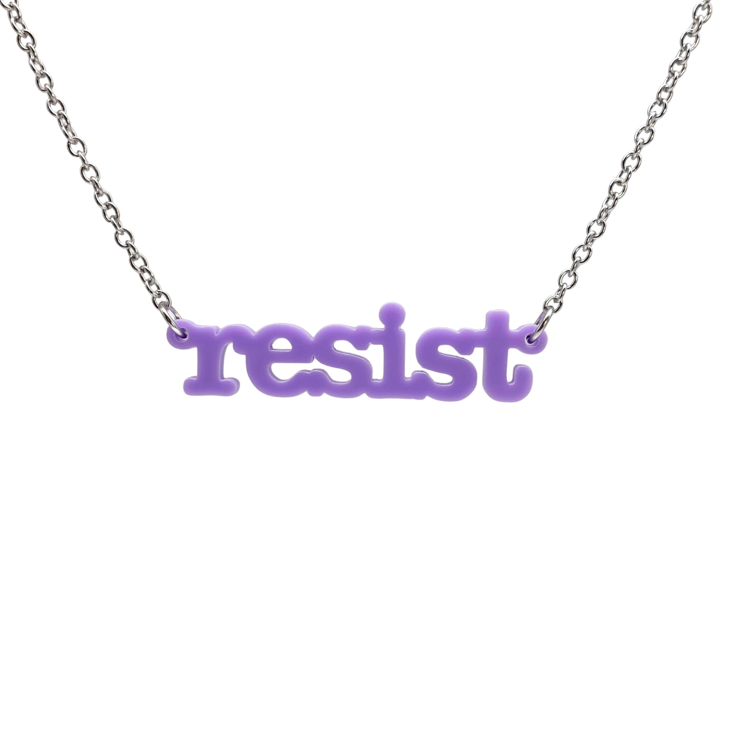 Typewriter Resist necklace in parma violet shown hanging on a stainless steel chain against a white background. 