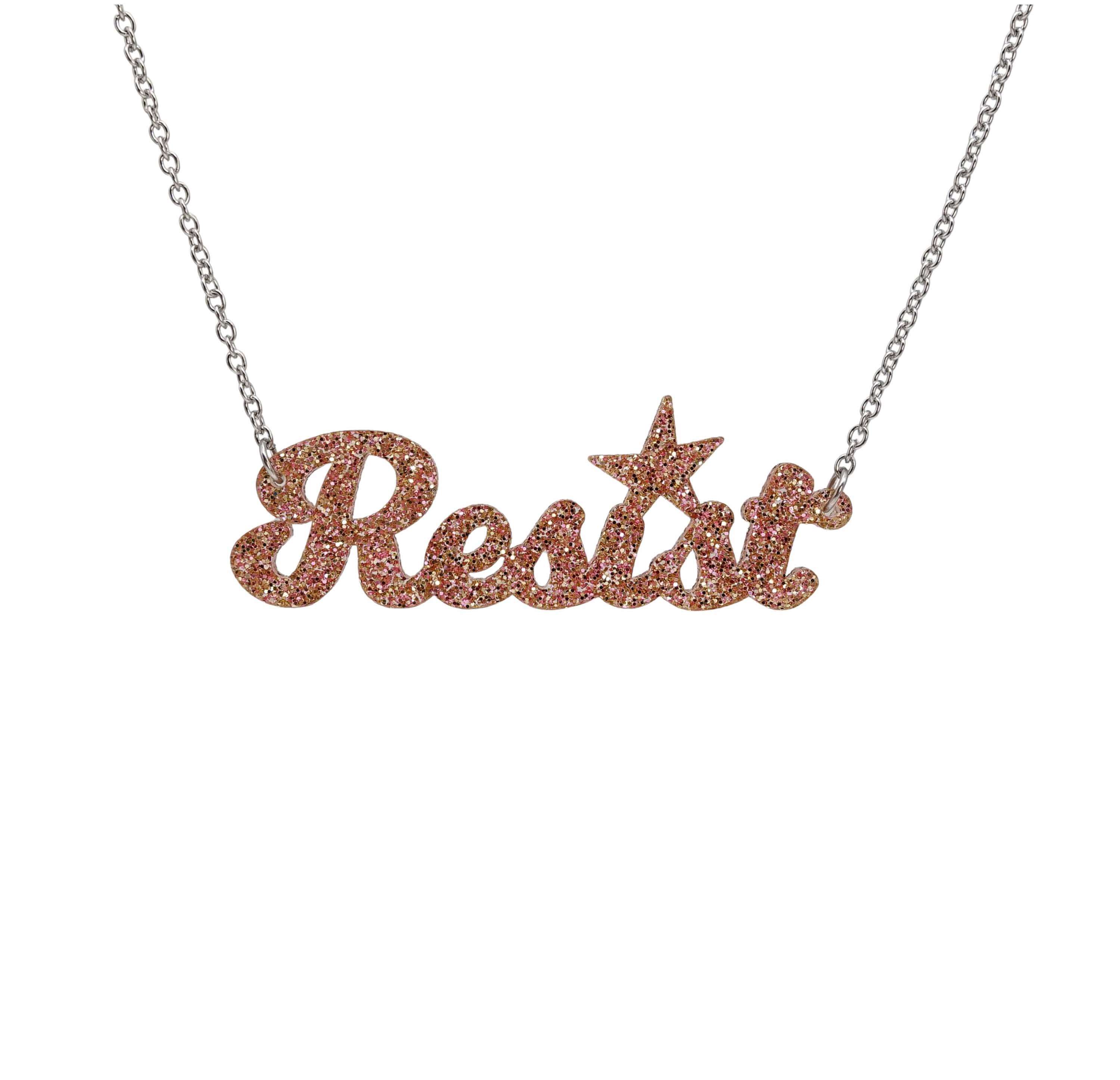 Resist necklace in pink fizz glitter, shown hanging against a white background. 