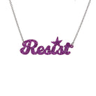 Resist necklace in violet glitter, shown hanging against a white background. 
