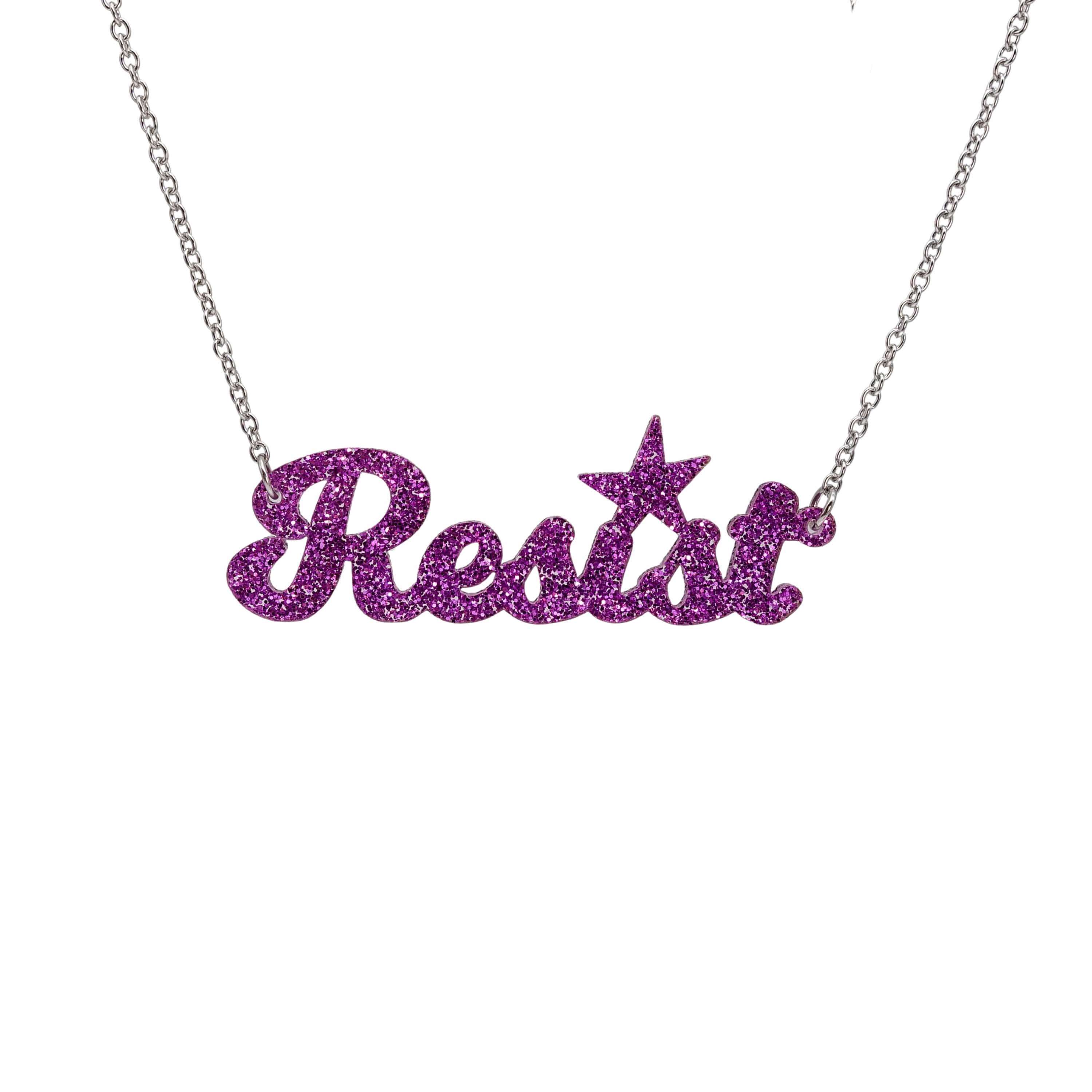 Resist necklace in violet glitter, shown hanging against a white background. 