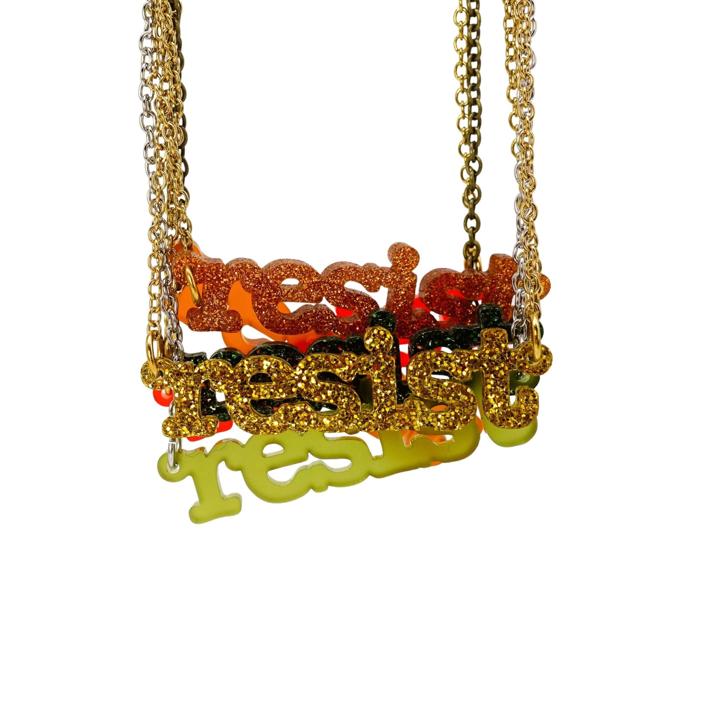 New autumn colour typewriter Resist necklaces, shown all hanging together against a white background. 