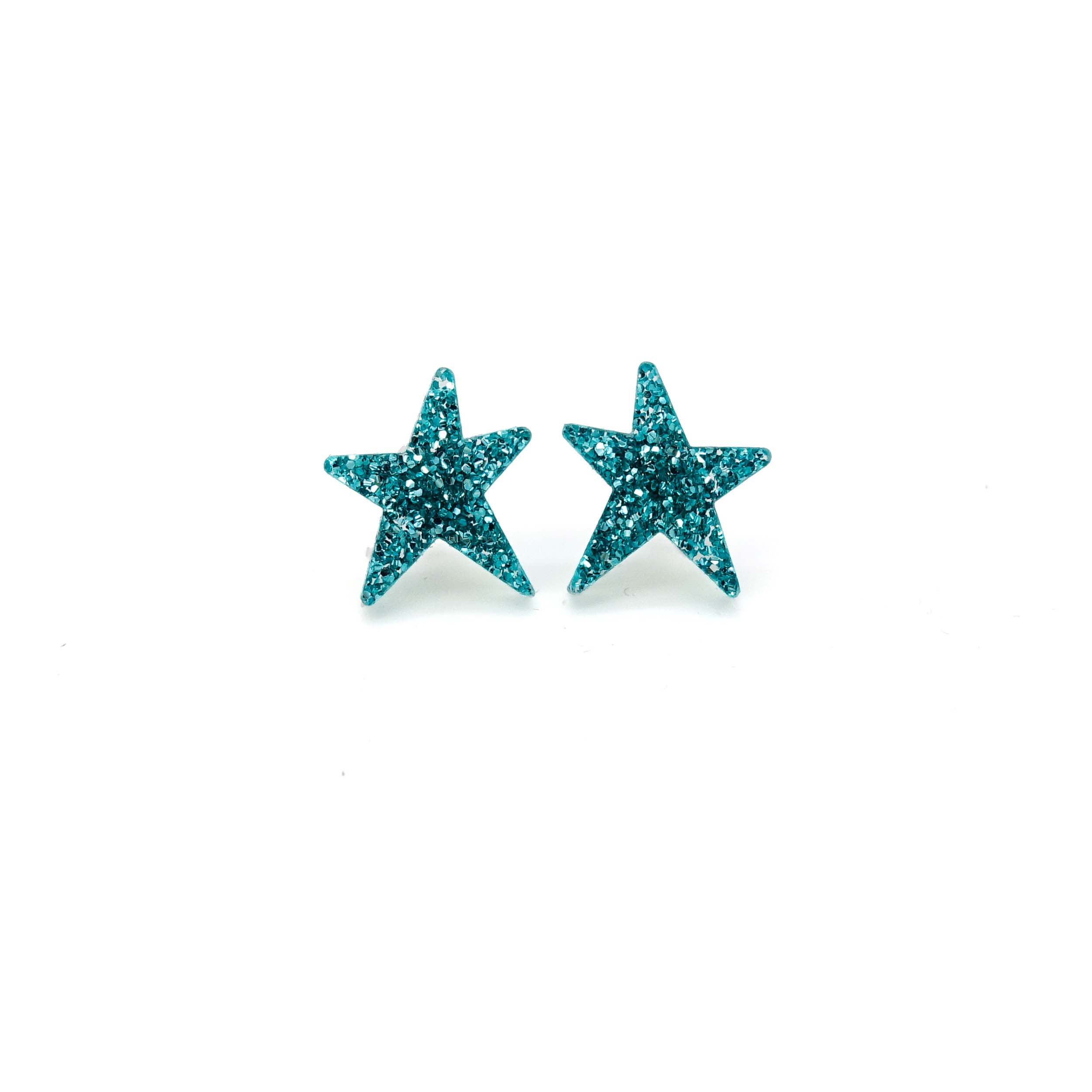 Teal glitter funky Wear and Resist star earrings shown on a white background. 