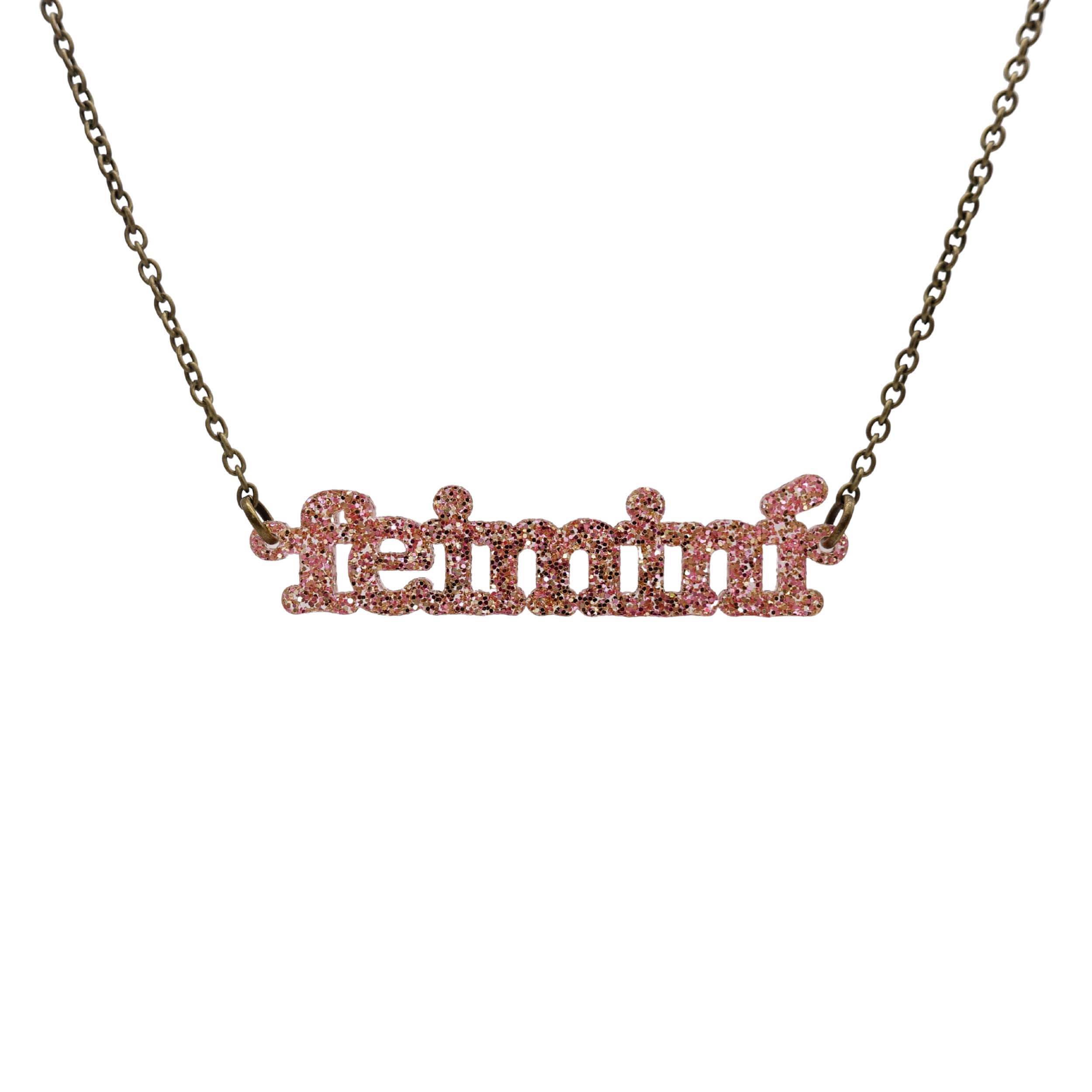 Irish Gaelic Feiminí necklace in rose glitter, shown hanging against a white background. 