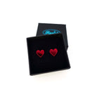 Ruby mirror small heart earrings, shown in a small Wear and Resist gift box. 