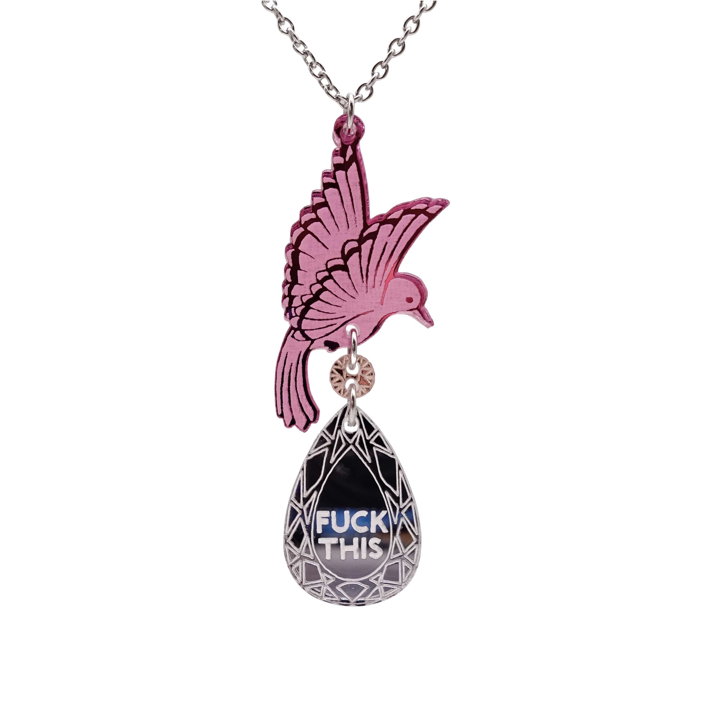 An acrylic pendant necklace with a pink bird holding a silver 'jewel' that says 'F*ck This'.