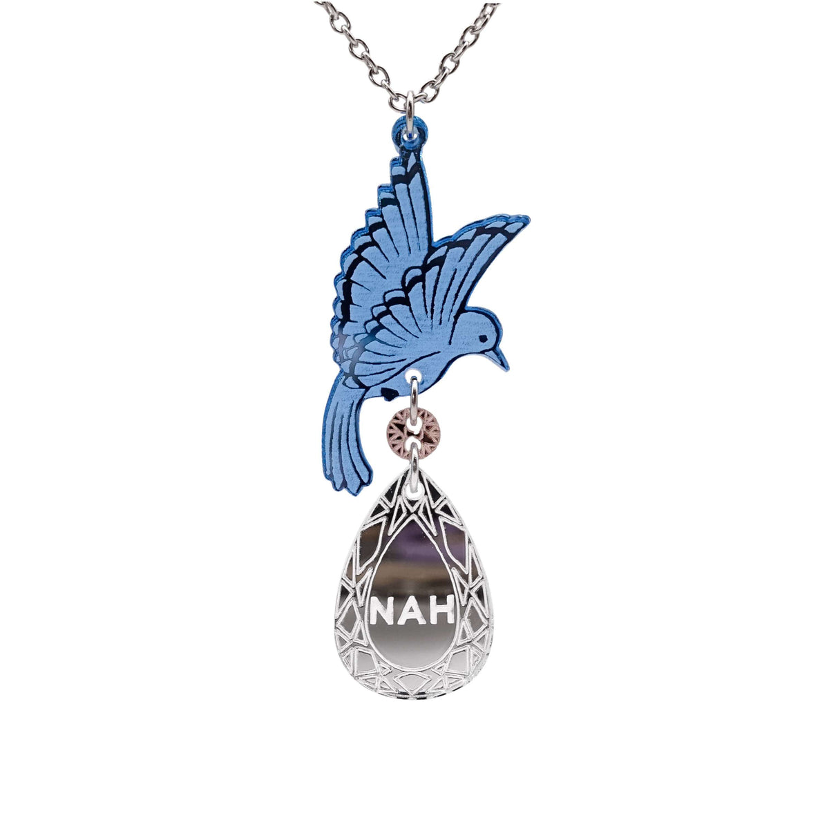 An acrylic pendant necklace with a blue bird holding a silver 'jewel' that says 'Nah.'
