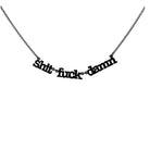 Sh*t f*ck d*mn necklace in matte black shown hanging in front of a white background. 