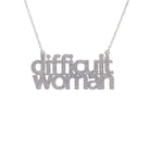 Difficult Woman necklace in silver glitter, shown hanging against a white background. 