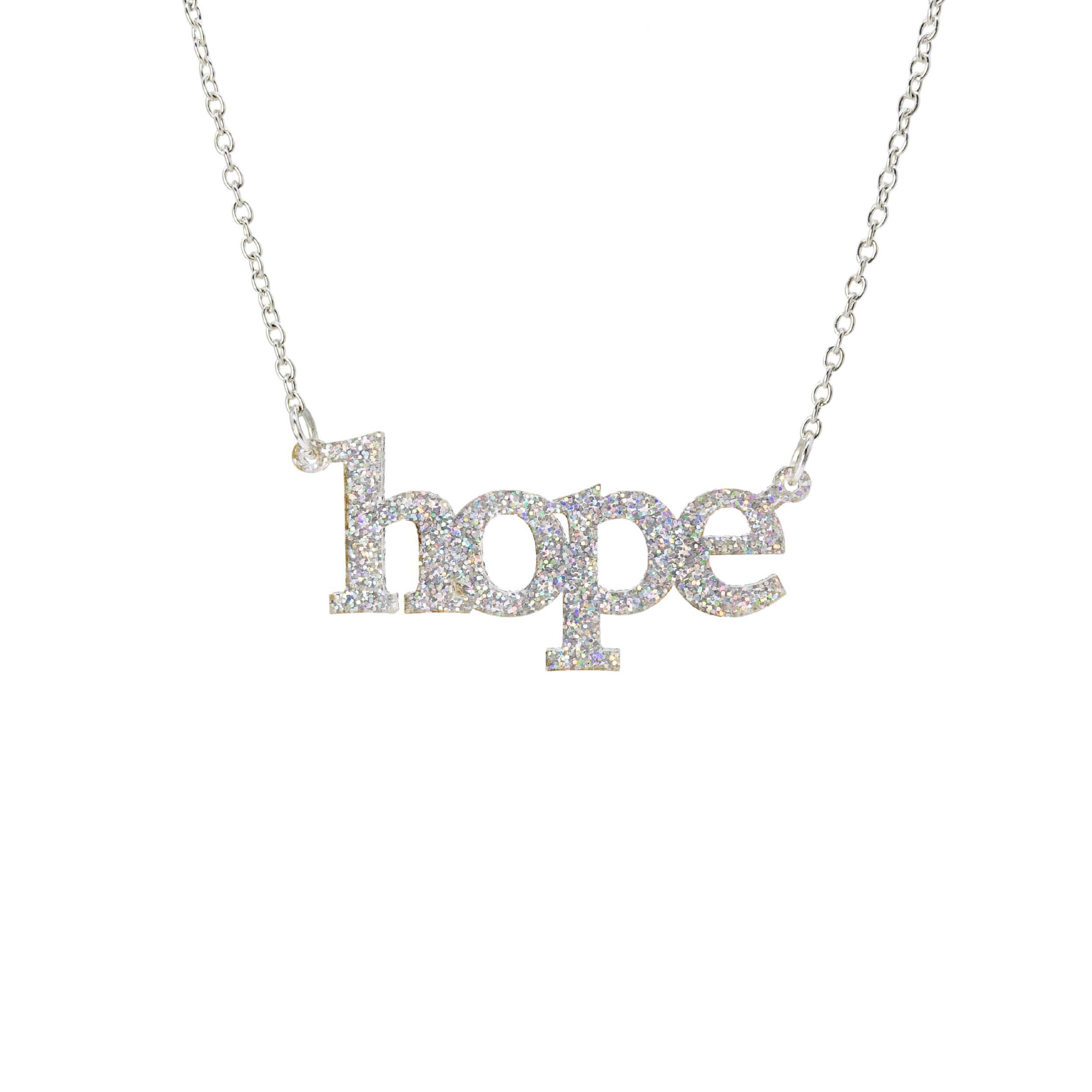 Hope necklace in silver glitter shown on a silver chain hanging on a white background. 