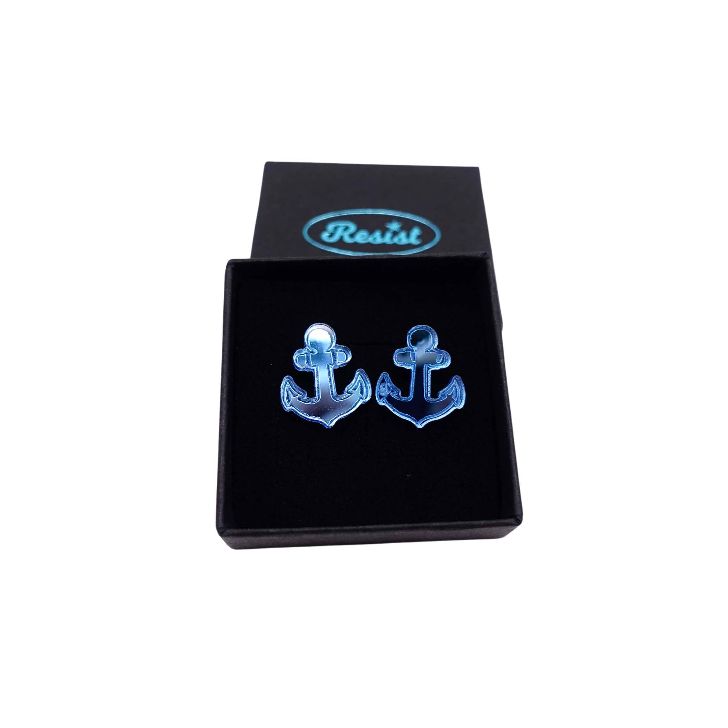 Sky mirror little anchor earrings shown in a Wear and Resist gift box. 