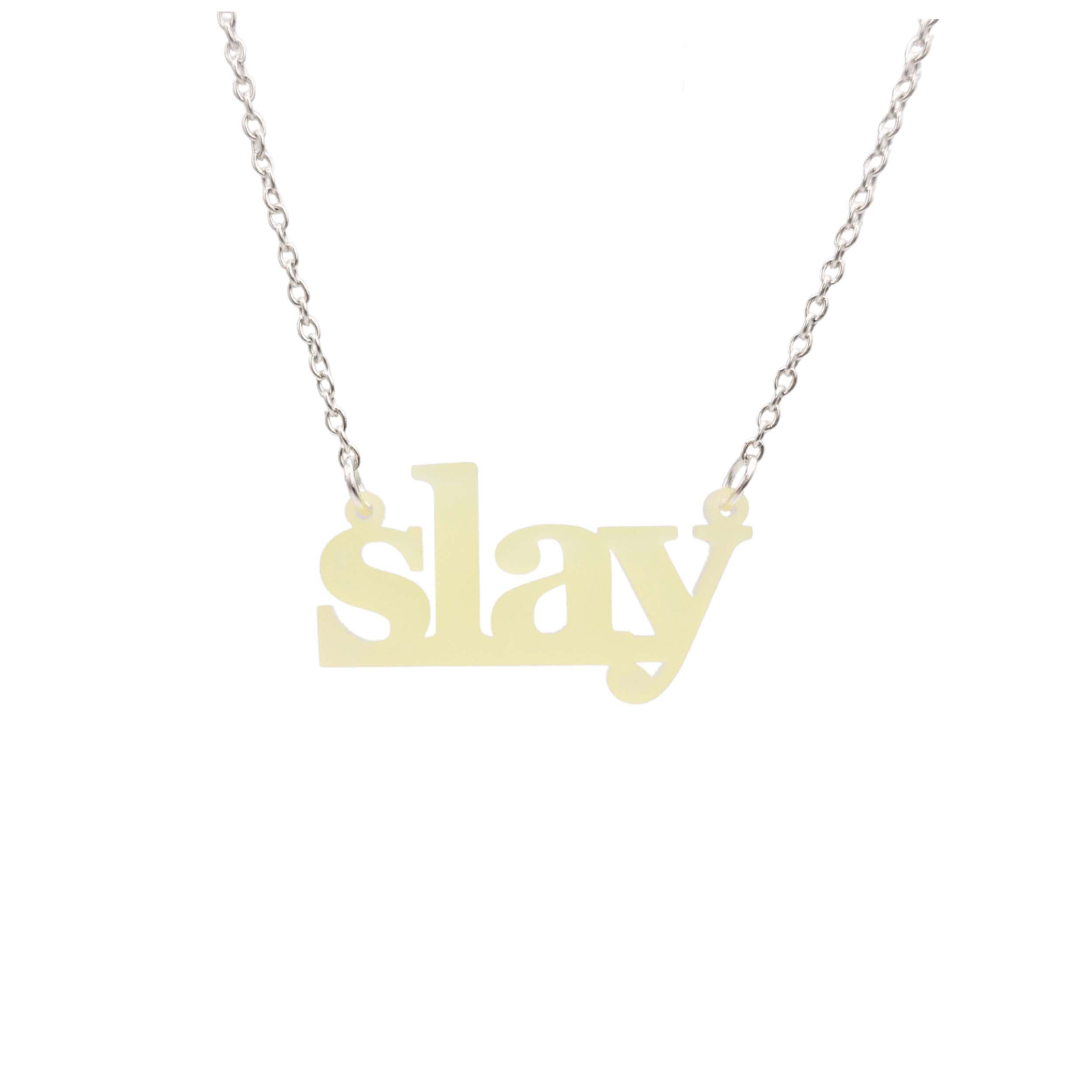 Slay necklace in uranium yellow on a silver chain shown hanging against a white background. Designed by Sarah Day for Wear and Resist. £2 goes to Women for Refugee Women charity. 