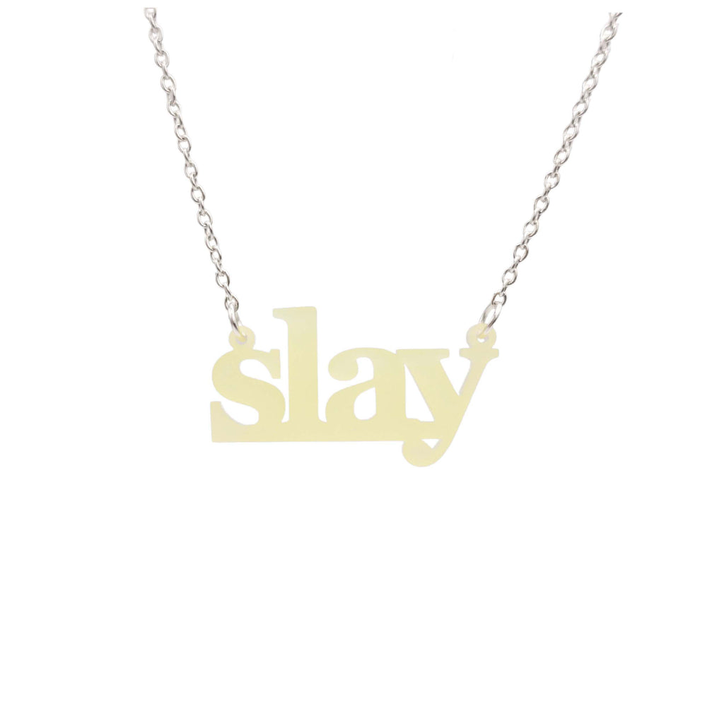 Slay necklace in uranium yellow on a silver chain shown hanging against a white background. Designed by Sarah Day for Wear and Resist. £2 goes to Women for Refugee Women charity. 