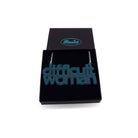 Difficult Woman necklace in teal frost, shown in a Wear and Resist gift box.