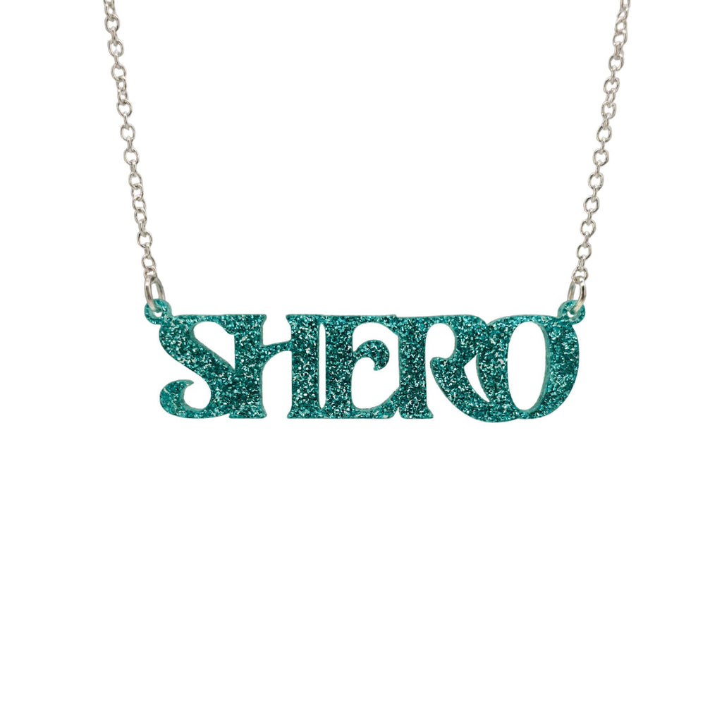 Teal glitter Shero necklace shown in a Wear and Resist gift box. 