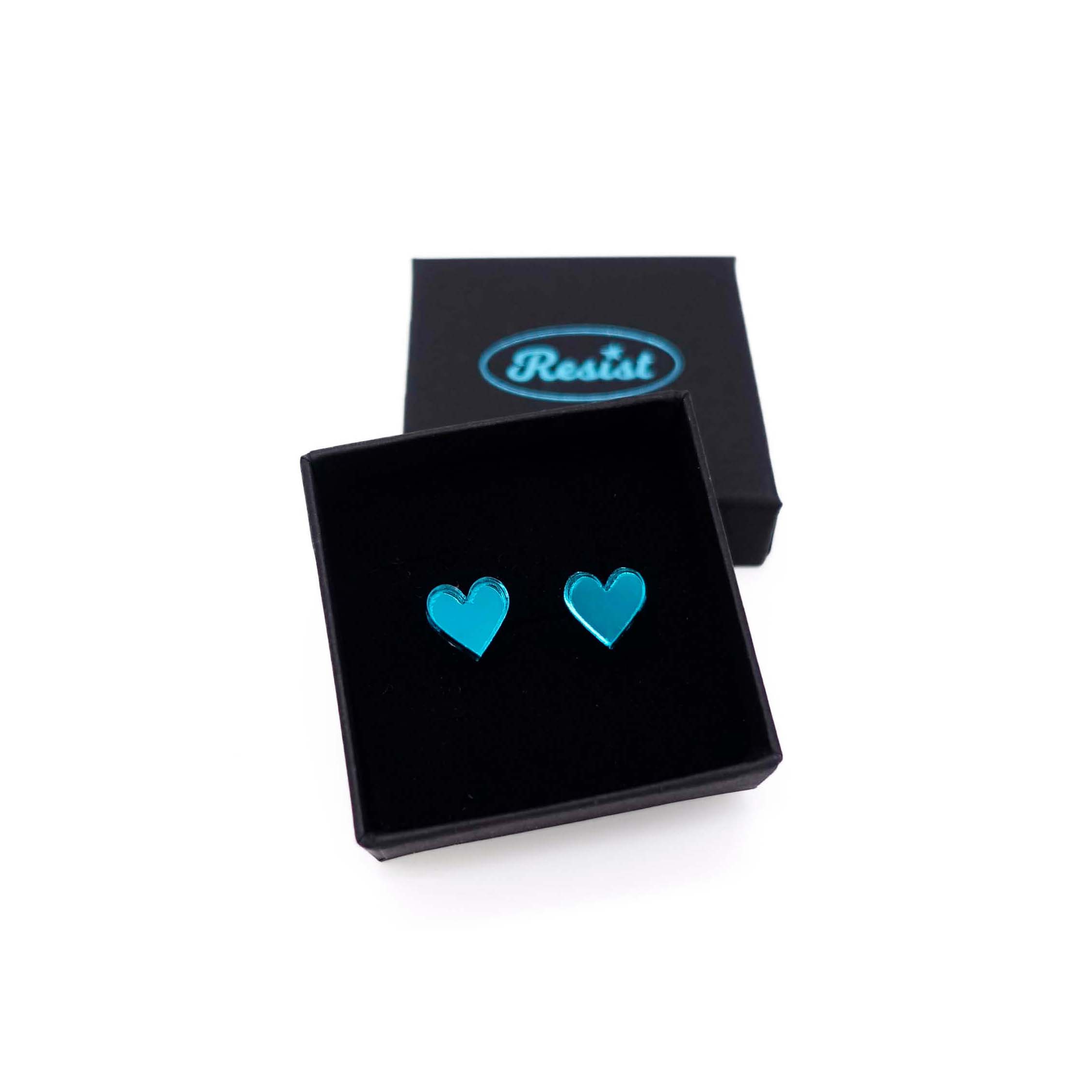 Teal mirror small heart earrings, shown in a small Wear and Resist gift box. 