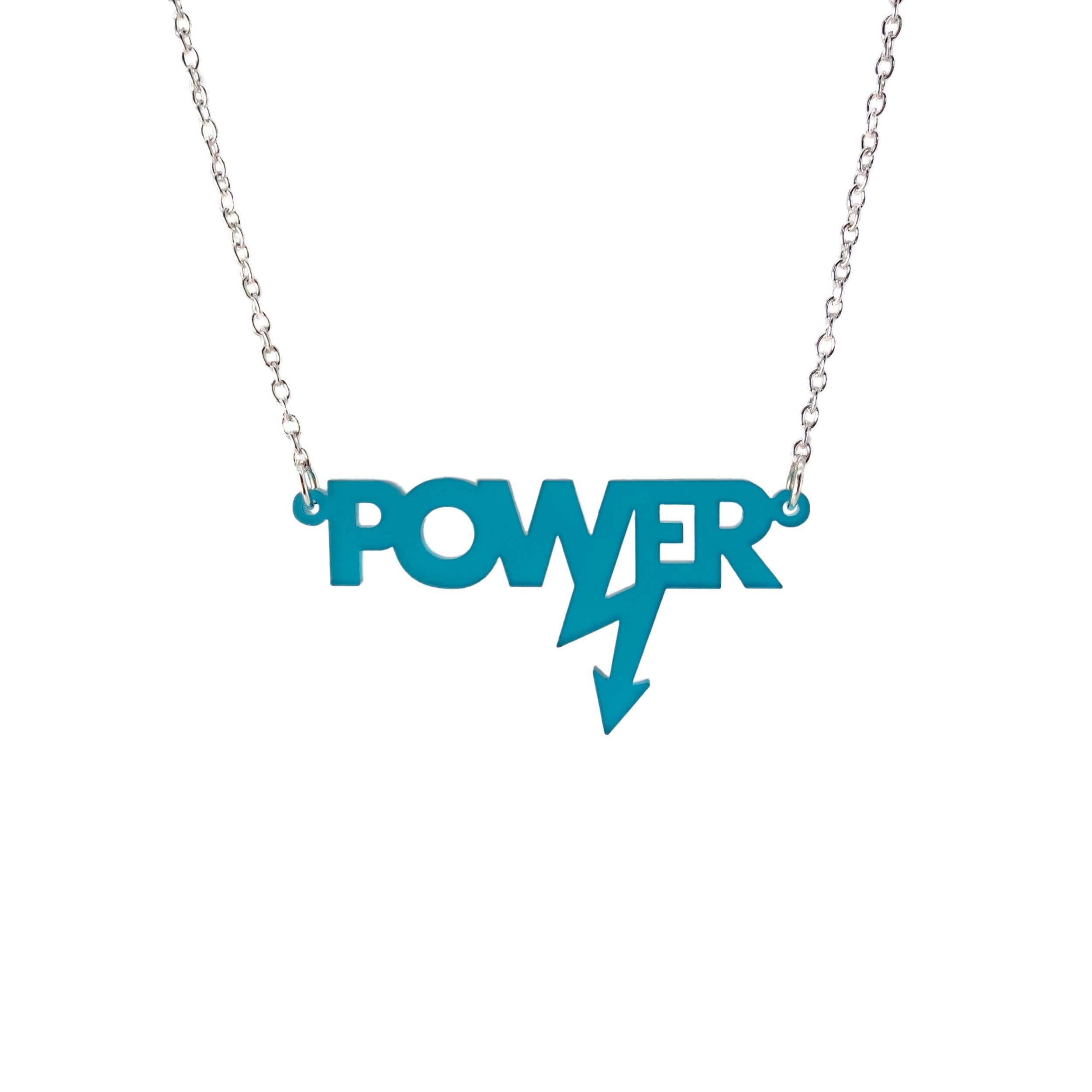 Mini power necklace in teal frost shown hanging on a silver chain against a white background. Designed in collaboration with Mary Beard for her book Women and Power. 