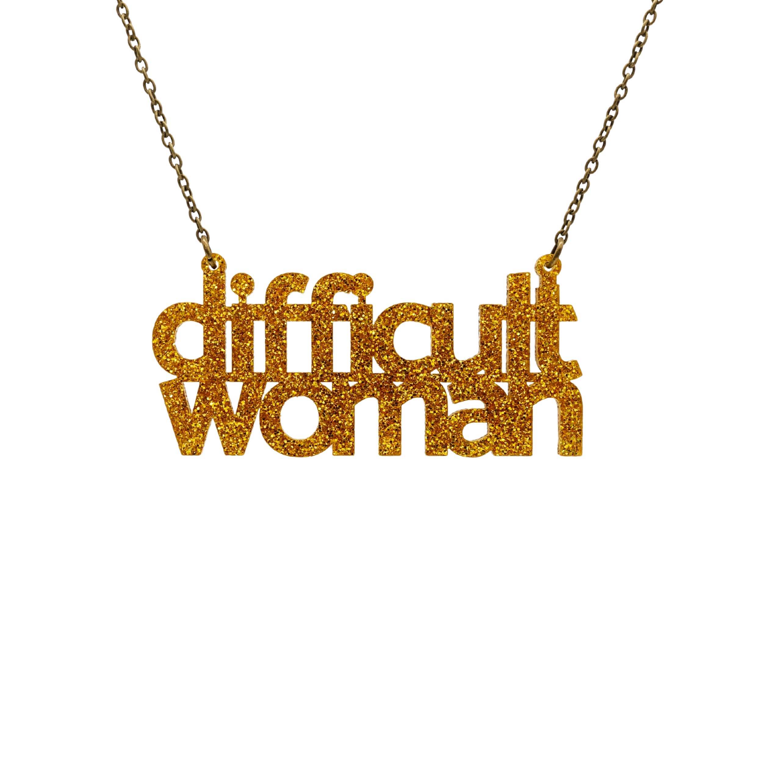 Difficult Woman necklace in ultra gold glitter, shown hanging against a white background. Stay difficult, stay awkward! 