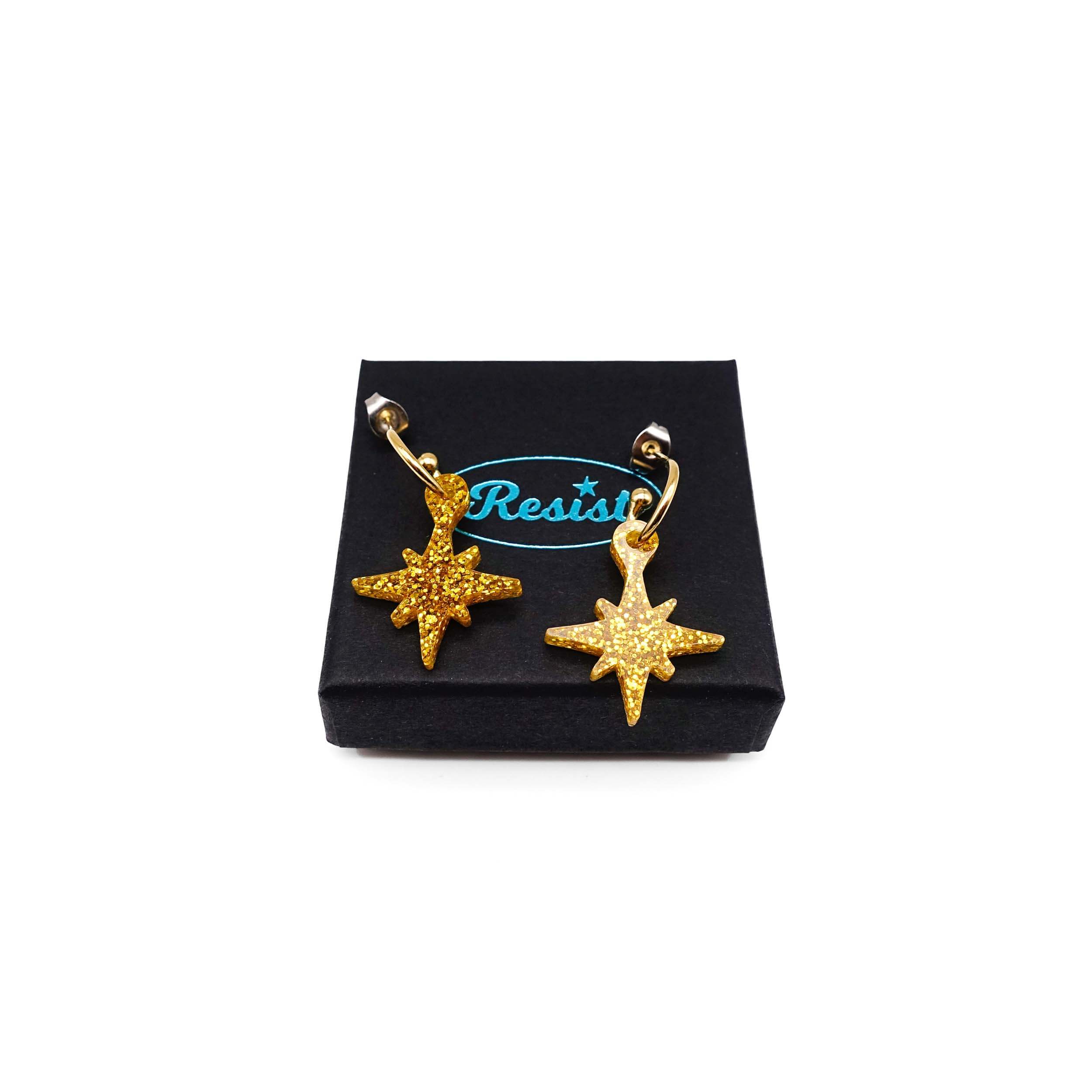 Ultra gold glitter limited edition Festive Vintage Star earrings, shown on a Wear and Resist gift box.  