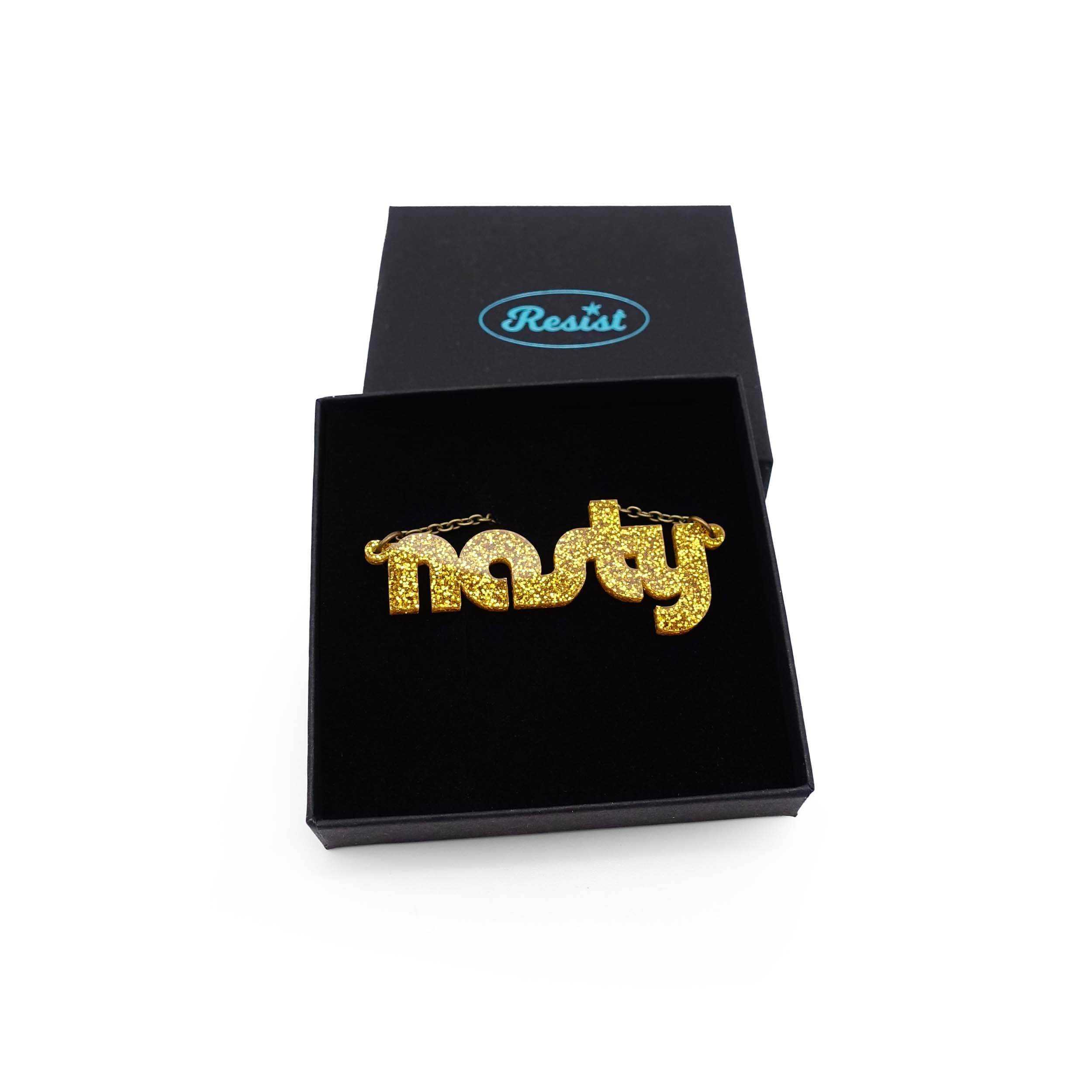 Nasty necklace in ultra gold glitter, shown in a Wear and Resist gift box. 