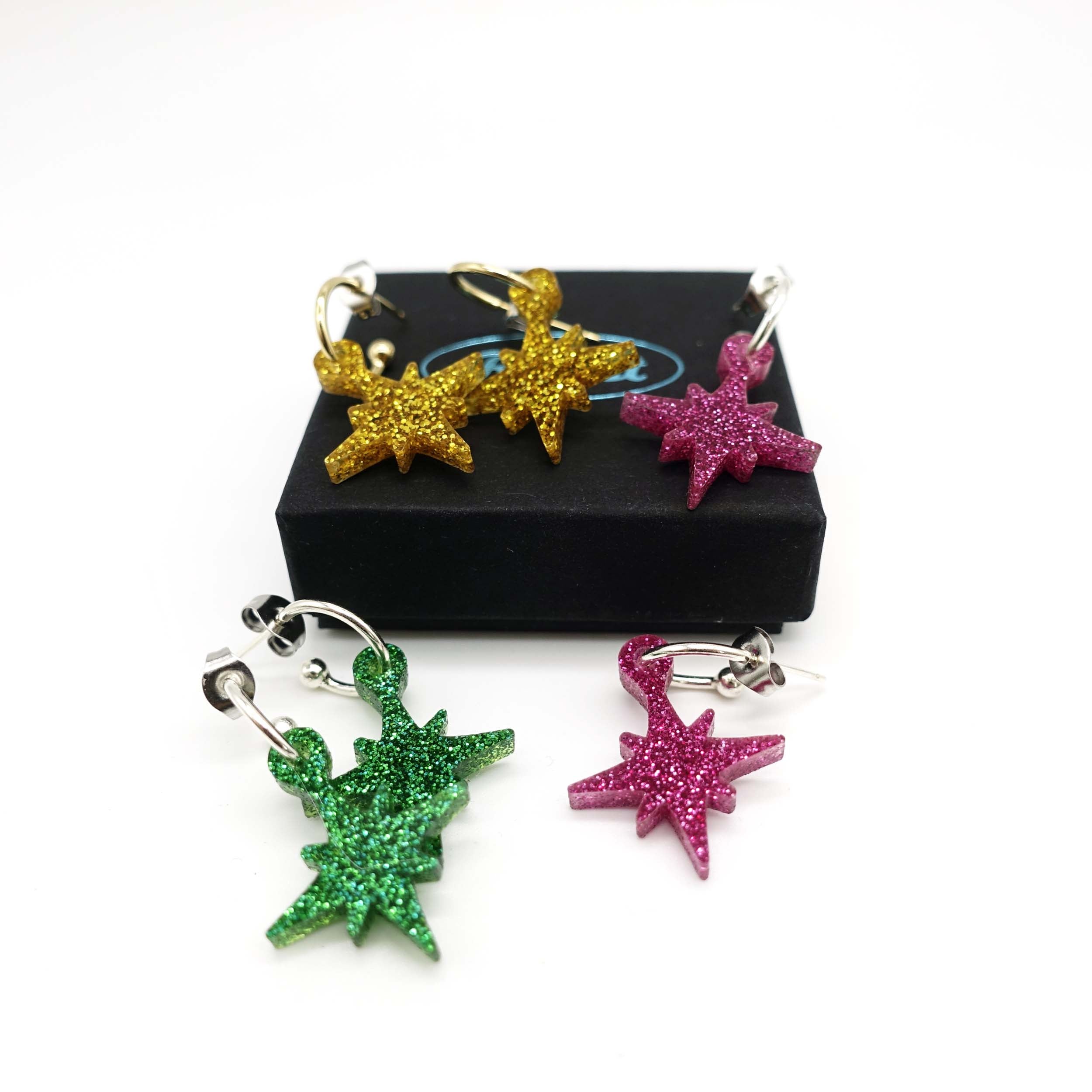 A group shot showing all three new colours of Vintage Star Christmas earring hoops with a Wear and Resist gift box. 