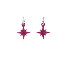 Hot pink glitter vintage star earrings on hoops shown hanging on a white backround. 